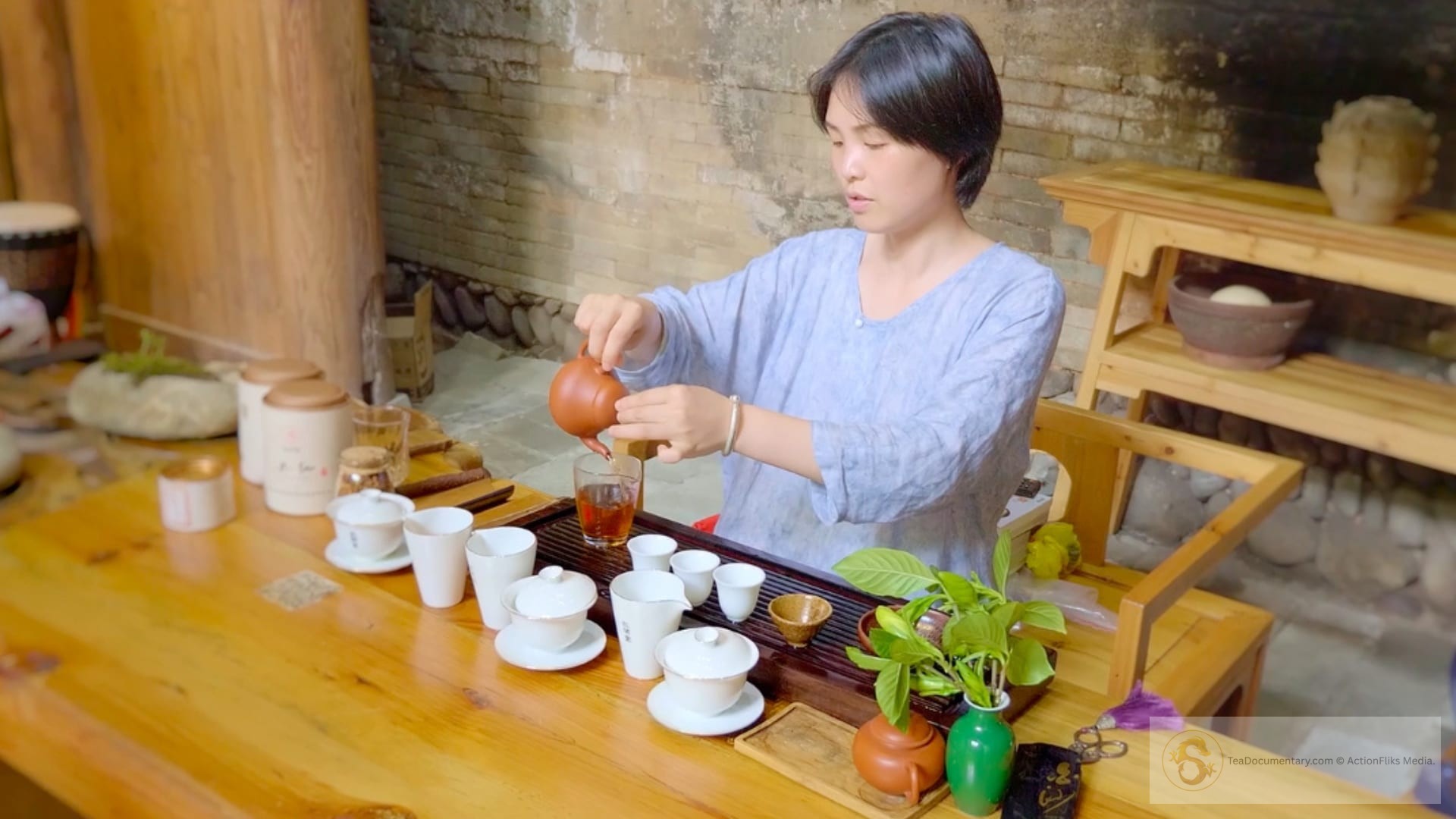 Tea Documentary: The Incredible Story of Tea 2025 34 Tea master pouring gongfu cha with filmmaker Christy Hui in Wuyi Mountains, Fujian Province, China - birthplace of tea etymology