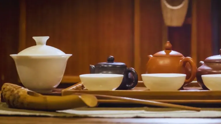Chinese Tea Tasting 14 Botanical garden tea events — Yixing clay teapots and a gaiwan set for a Gong Fu Cha tea tasting, from TEA: The Drink That Changed The World