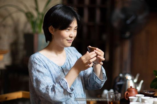 Wuyishan culture Chinese tea rituals gong fu cha tea tasting Duer Zhang a lady holding a cup with tea set teacups teapot